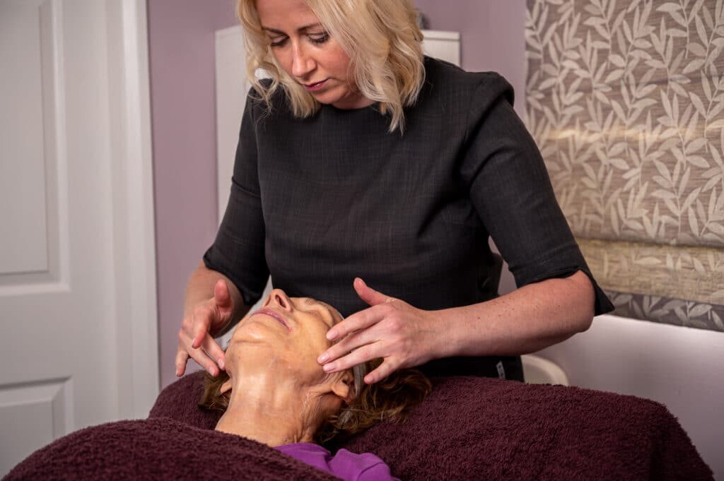 Fiona The Skinologist performing a facial skin treatment at her Chester skin clinic 2